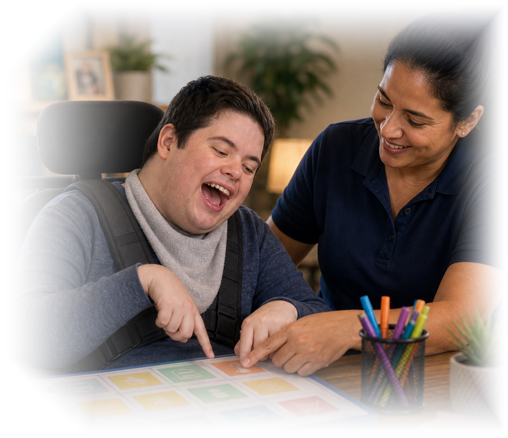 ButterflyCare caregiver supporting a young adult in a wheelchair during a communication activity